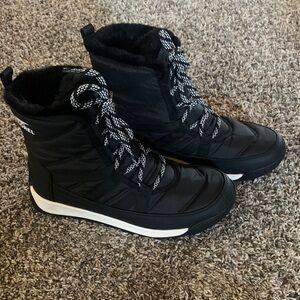 Sorel women’s Black and White Snow Boots